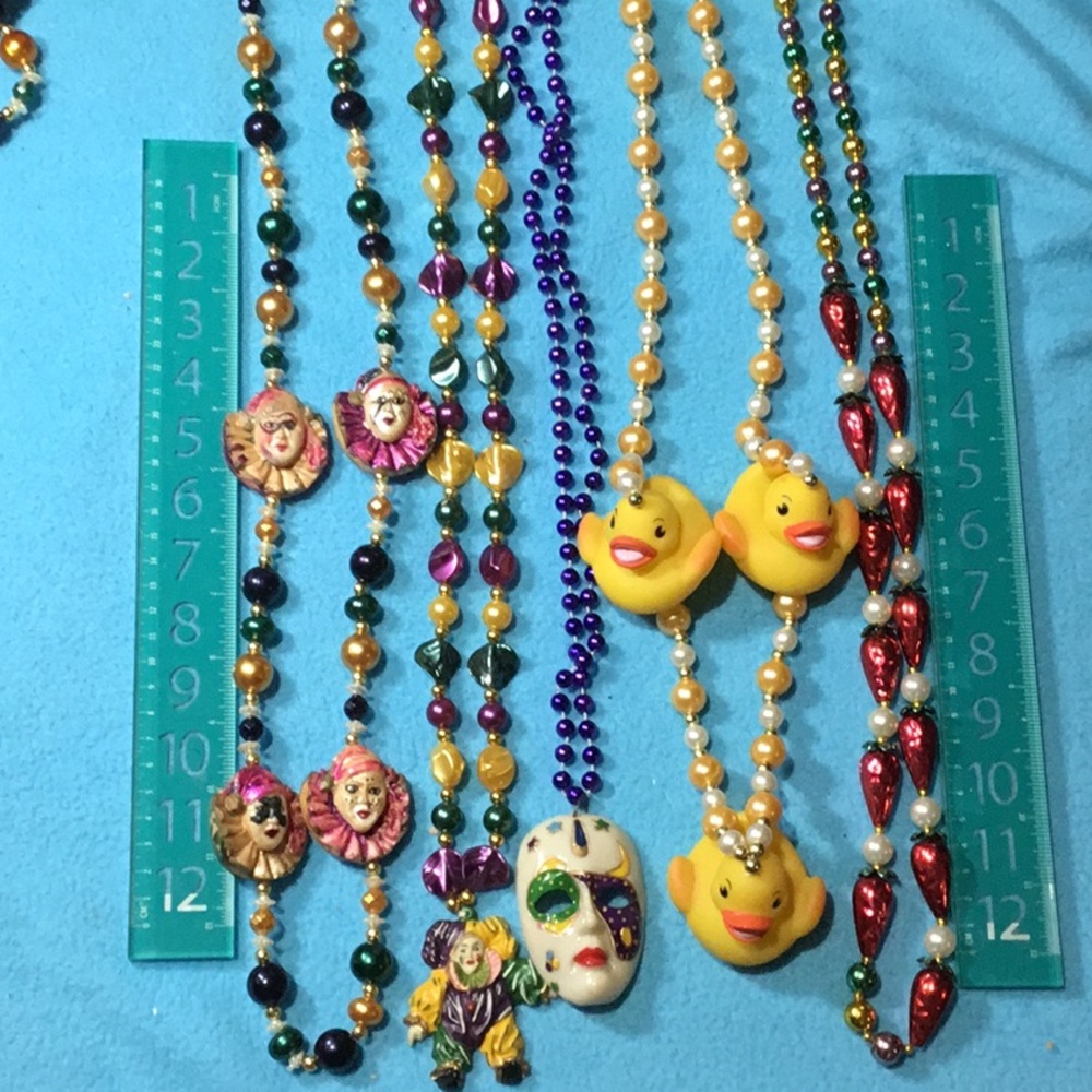 Five vintage and hand strung Mardi Gras Beads